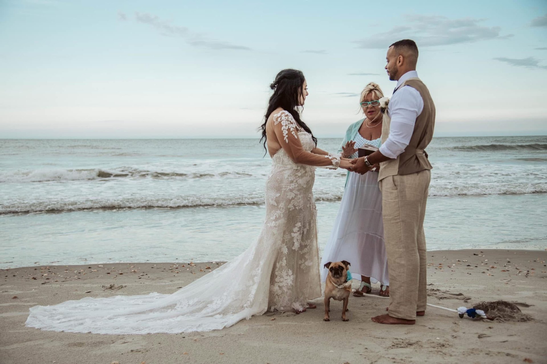 Beach elopement ceremony with pup